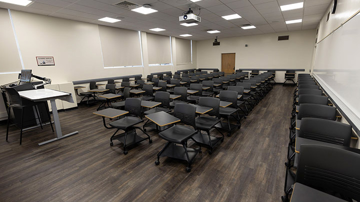 Front of classroom showing the podium and projector