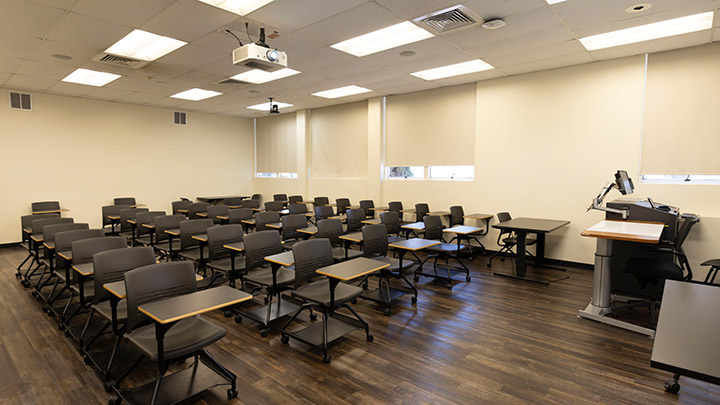 Front of classroom showing the podium and projector