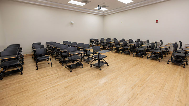 Front of classroom showing the podium and projector