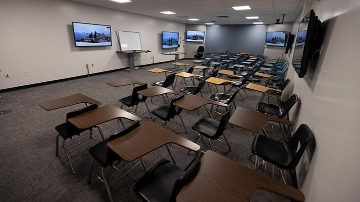 Classroom with podium and screens