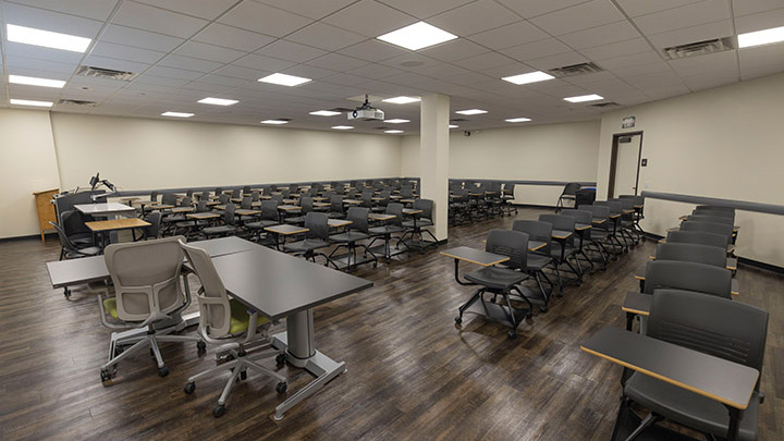 Front of classroom showing the podium and projector