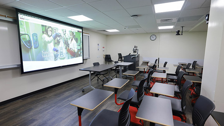 Classroom with podium and projection screen