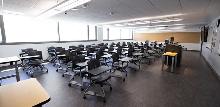 Front of classroom, view from the side showing the podium and seating