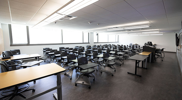 Front of classroom from side, showing seating and the podium 