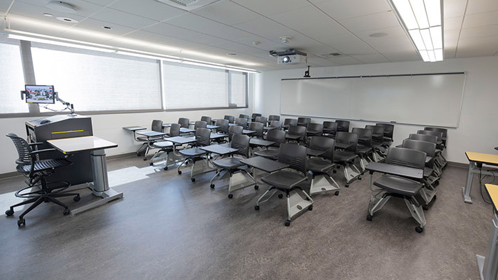 Front of classroom showing the podium and projector