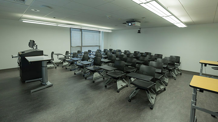 Front of classroom showing the podium and projector