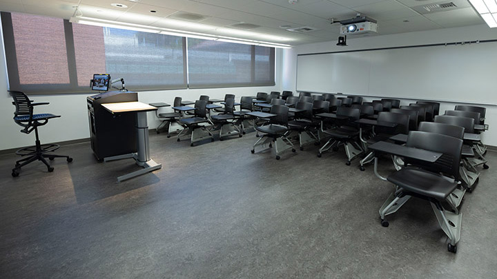 Front of classroom showing the podium and projector