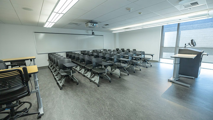 Front of classroom showing the podium and projector