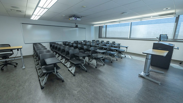 Front of classroom showing the podium and projector