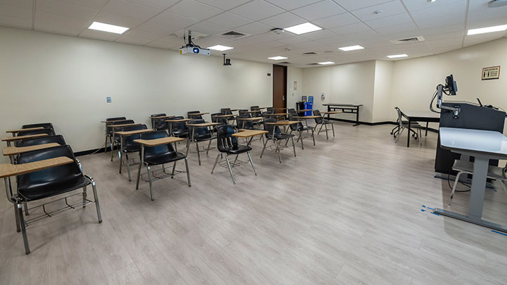 Front of classroom showing the podium and projector