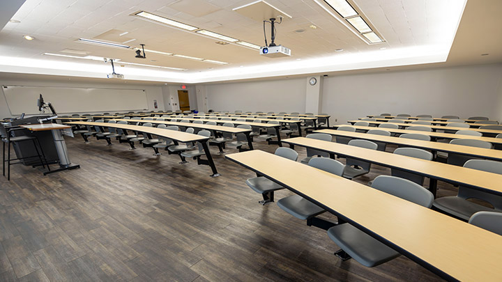 Front of classroom showing the podium and projector