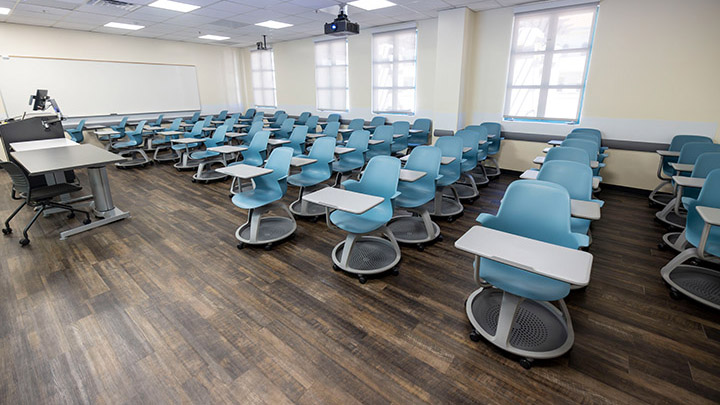 Front of classroom showing the podium and projector