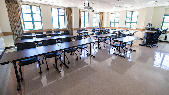 Front of classroom showing the podium and projector