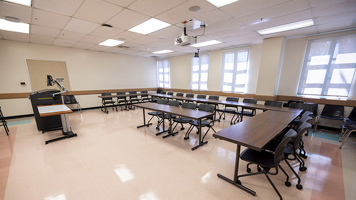 Front of classroom showing the podium and projector