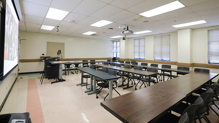 Front of classroom showing the podium and projector