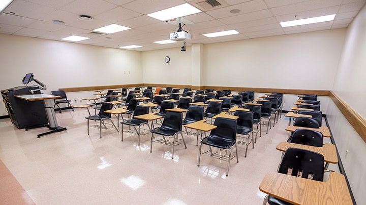 Front of classroom showing the podium and projector