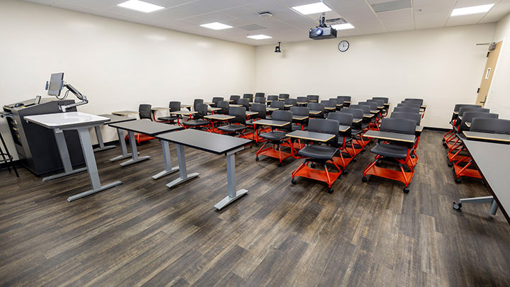 Front of classroom showing the podium and projector