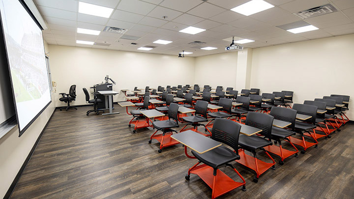 Front of classroom showing the podium and projector