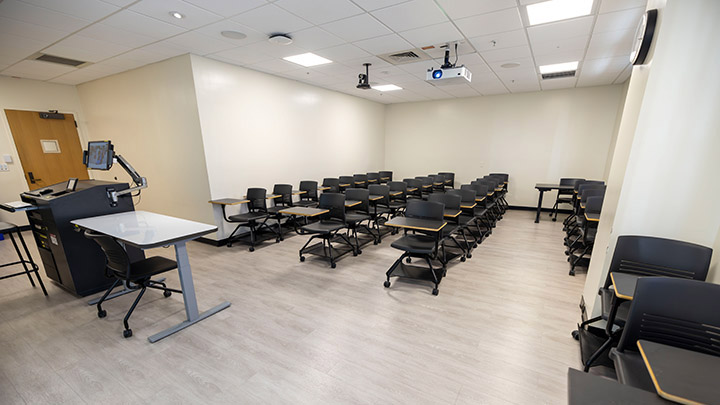 Front of classroom showing the podium and projector