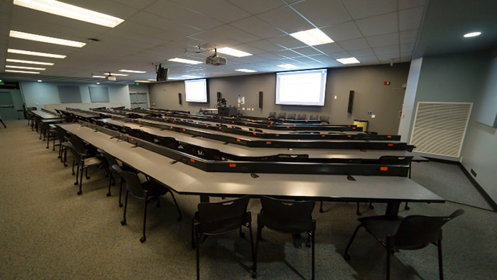 lecture hall with projection screen in background